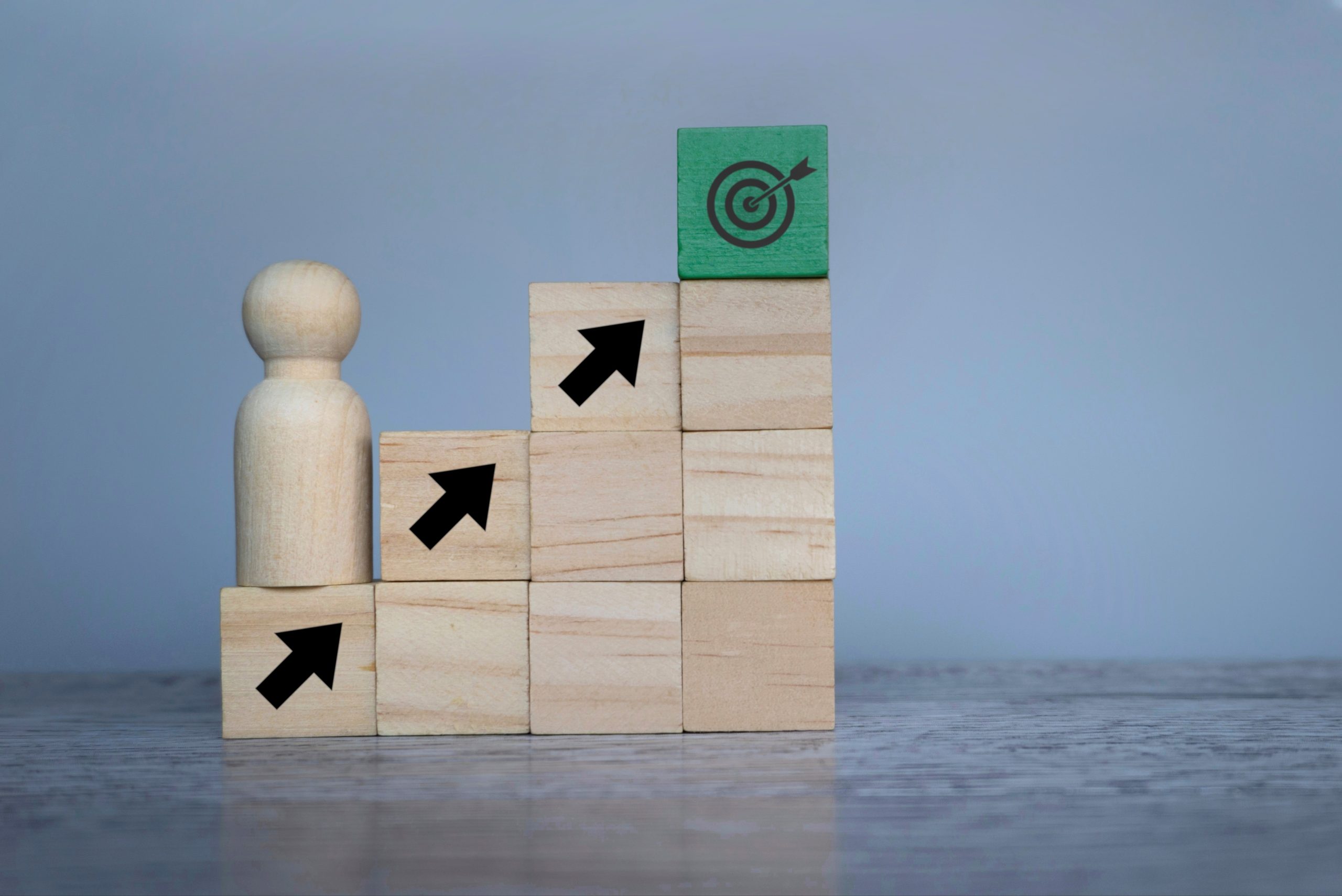 wooden-doll-with-upward-arrows-and-target-board-2025-03-16-03-18-46-utc